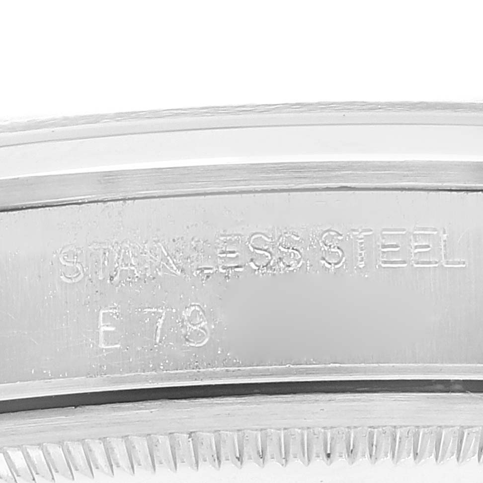 This is a close-up image of the case side of a Rolex Air-King 14000 Men's Stainless Steel Pink Dial 14000 Men's Stainless Steel Pink Dial watch, showing its stainless steel engraving and part of the bezel.