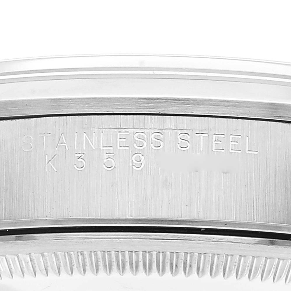 This image shows a close-up of the case back edge of a Rolex Air-King 14000M Men's Stainless Steel Black Dial 14000M Men's Stainless Steel Black Dial watch, highlighting the stainless steel material and inscription.