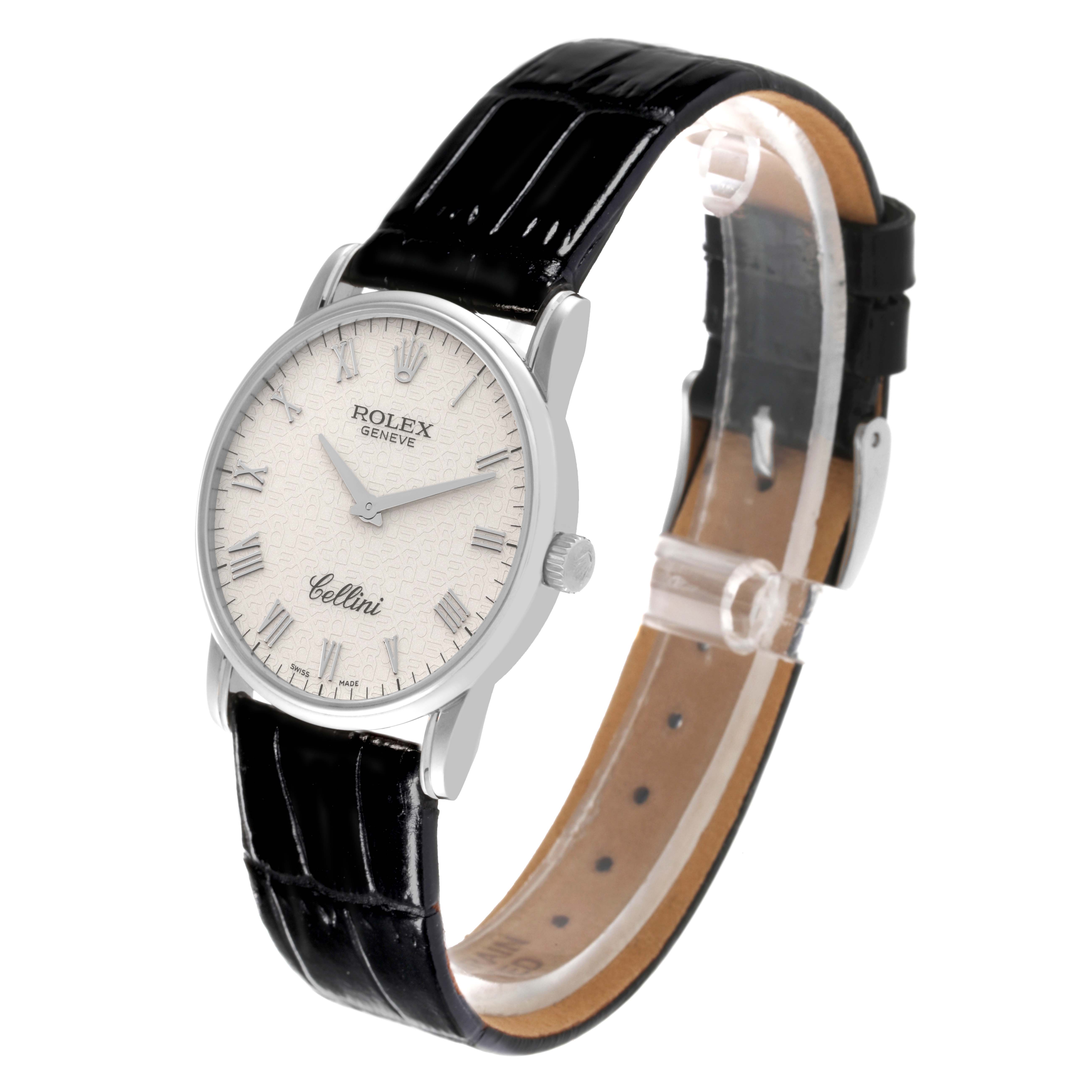 The Rolex Cellini 5116/9 Men
s White Gold Beige Dial 5116/9 Men
s White Gold Beige Dial watch is shown at a 3/4 angle, highlighting the white dial, silver case, and black leather strap.
