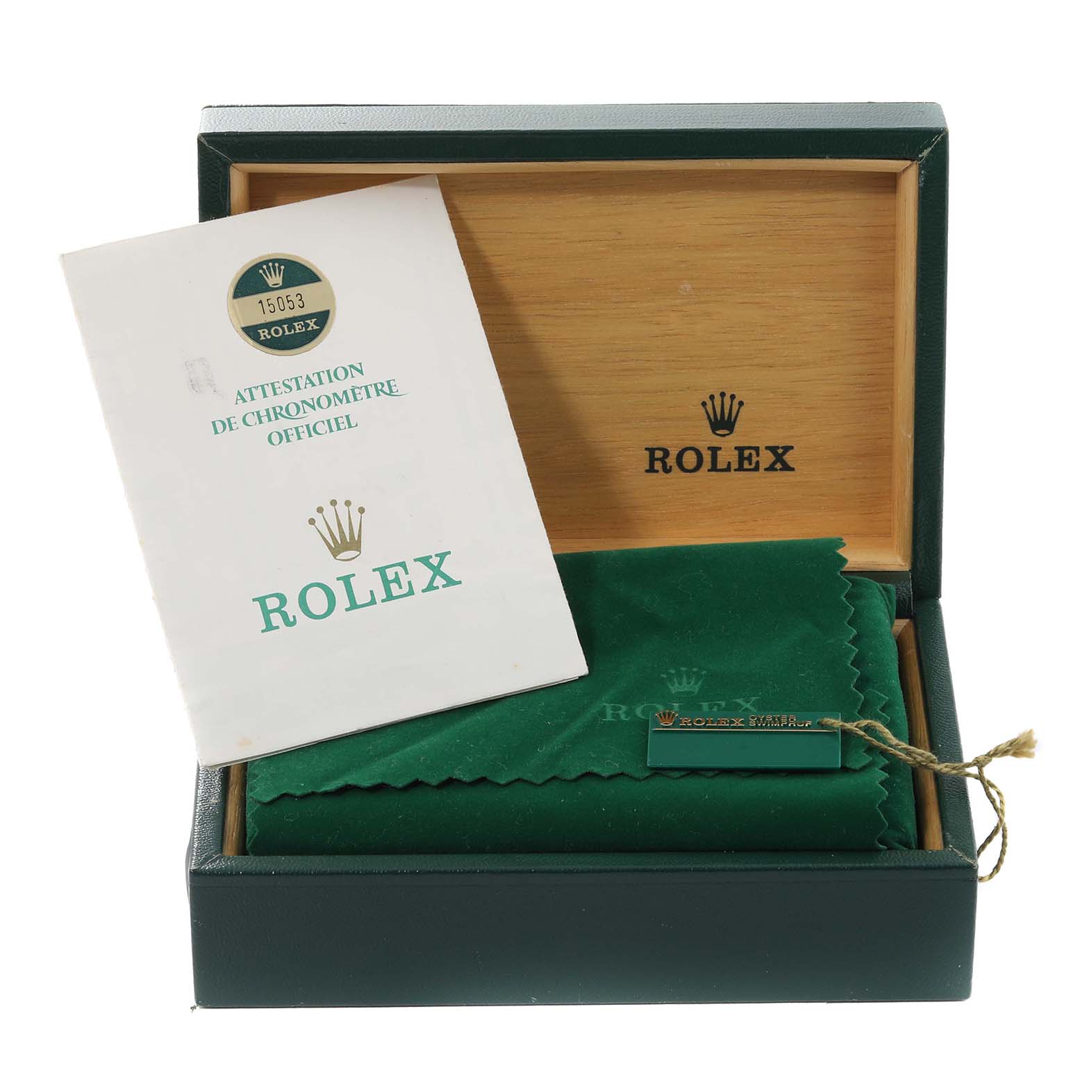 The image shows a Rolex Date 15053 Men's Steel and Gold (two tone) Champagne Dial 15053 Men's Steel and Gold (two tone) Champagne Dial model watch box with a certification booklet and a green cleaning cloth inside.