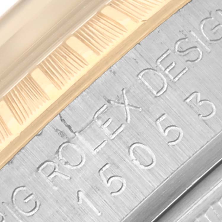 This image shows a close-up of the engraved side of the case and fluted bezel of a Rolex Date 15053 Men's Steel and Gold (two tone) Champagne Dial 15053 Men's Steel and Gold (two tone) Champagne Dial watch.