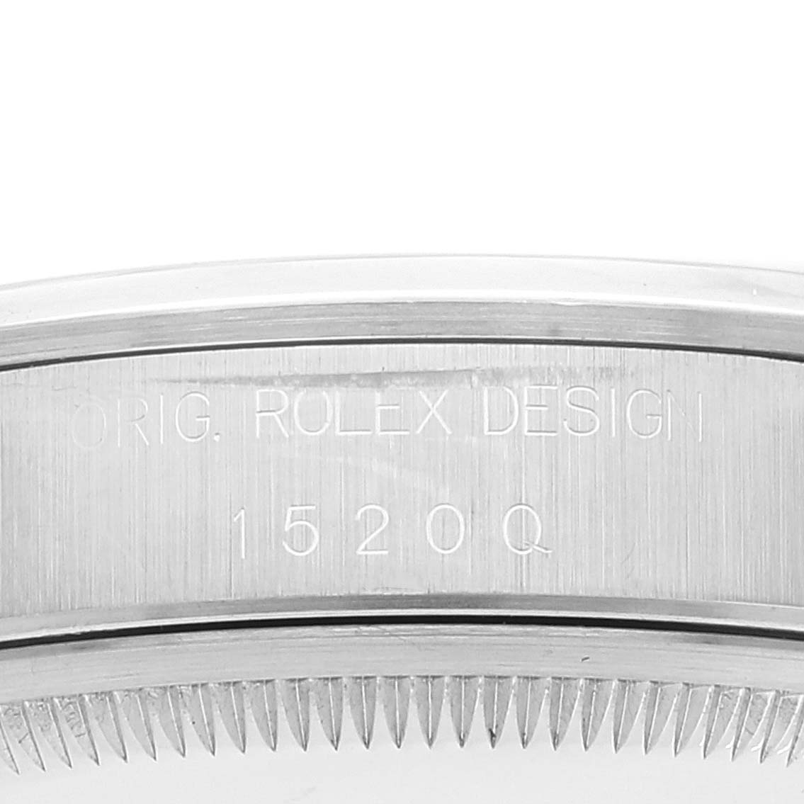 The image shows a close-up of the case number engraving on the side of a Rolex Date 15200 Men
s Stainless Steel Black Dial 15200 Men
s Stainless Steel Black Dial model watch.
