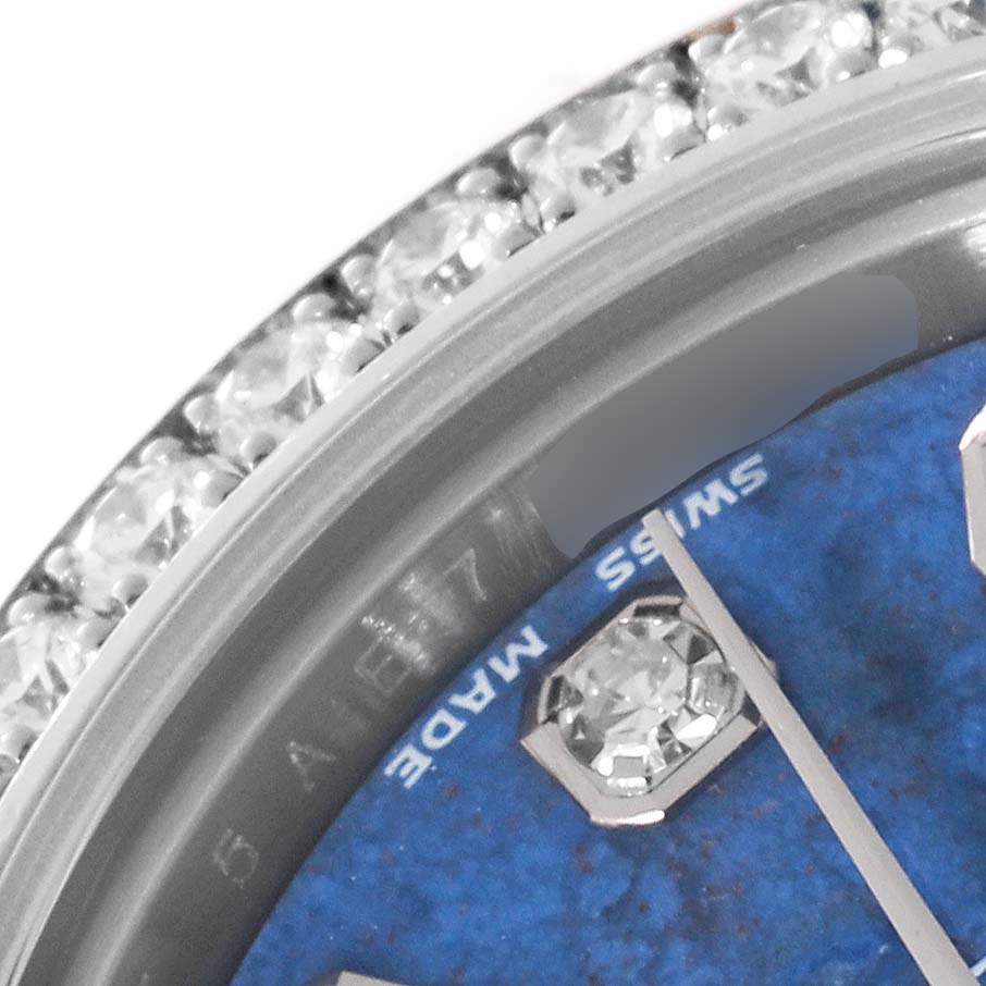 The image shows a close-up of a Rolex Datejust 179384 Women's Stainless Steel Blue Dial 179384 Women's Stainless Steel Blue Dial watch dial, bezel with diamonds, and part of the blue watch face with 'SWISS MADE' text visible.