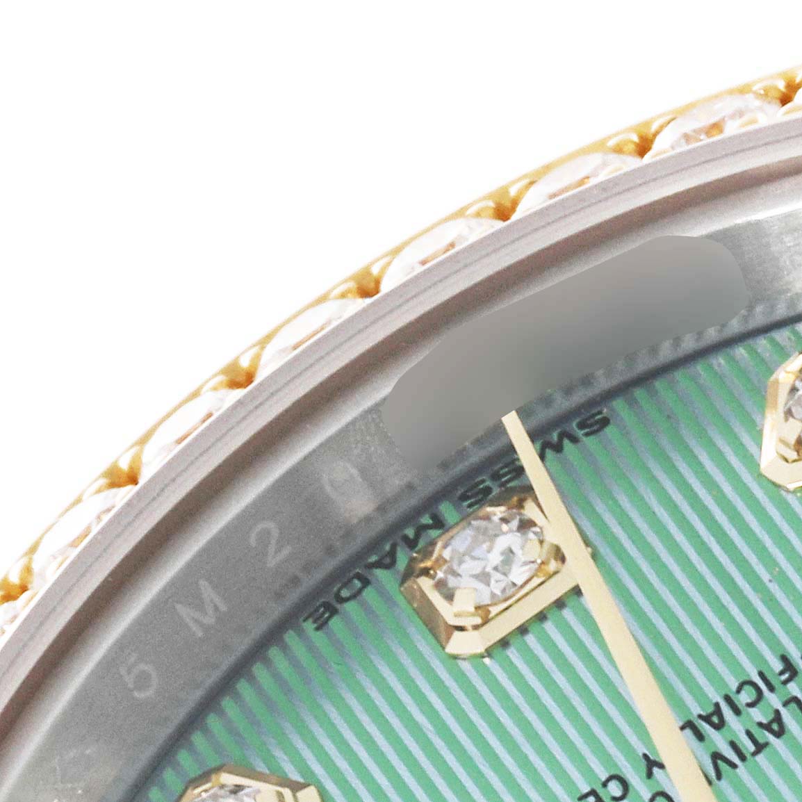 The image shows a close-up of the bezel and part of the green dial with diamond markers of a Rolex Datejust 279383 Women's Steel and Gold (two tone) Green Dial 279383 Women's Steel and Gold (two tone) Green Dial watch.