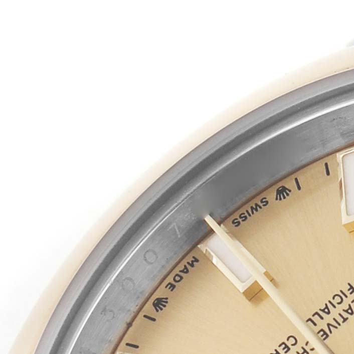 The image shows a close-up of the dial, hand, and partial bezel of a Rolex Datejust 279173 Women's Stainless Steel Champagne Dial watch at an angled view.