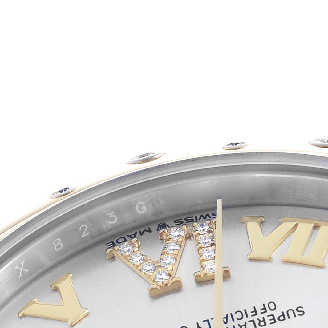 The image shows a close-up of the Rolex Datejust 278343 Women's Steel and Gold (two tone) Silver Dial watch, featuring the dial with diamond-set Roman numerals.