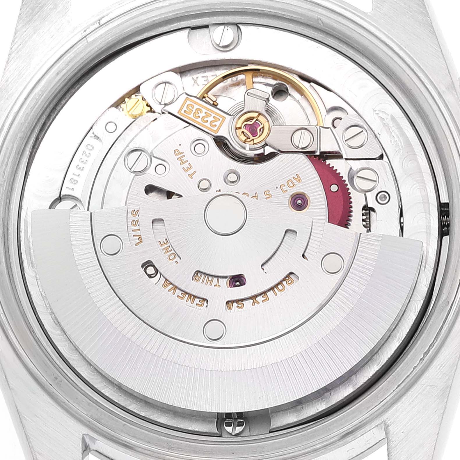 The image shows the internal mechanics and movement of a Mid-Size Rolex watch, viewed from the back case.