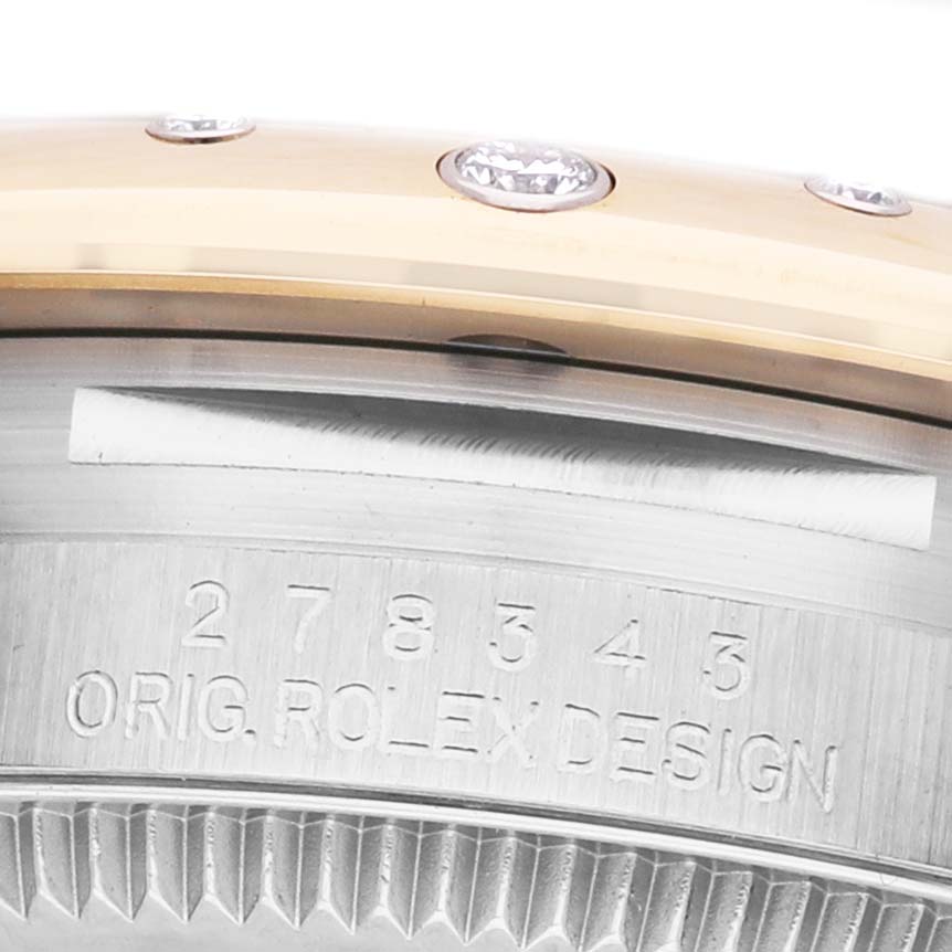 The image shows a close-up of the side and bezel of a Rolex Datejust 278343 Women's Steel and Gold (two tone) Grey Dial, highlighting the engraved model number and gemstone settings.