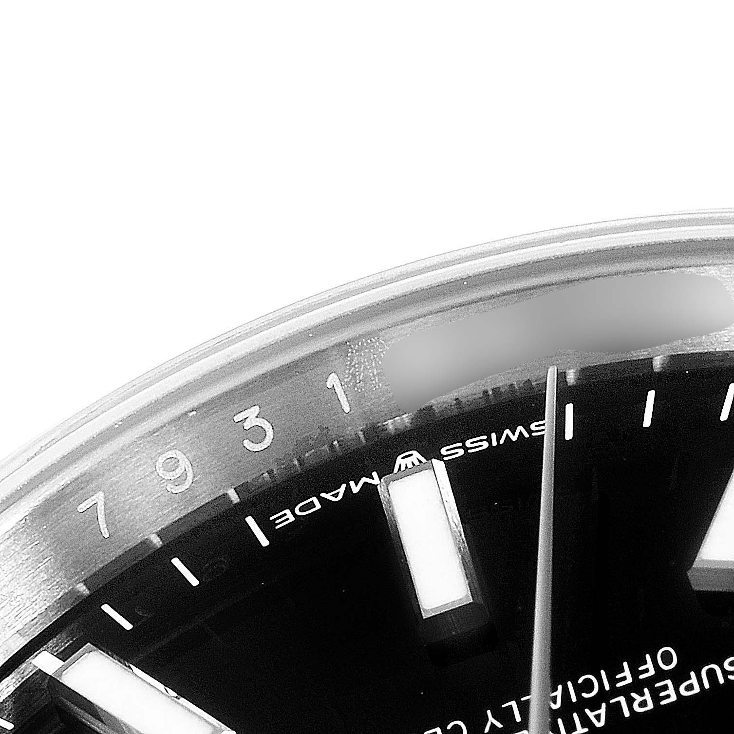 The image shows a close-up of the dial and part of the rotating date bezel of a Rolex Datejust 126200 Men's Stainless Steel Black Dial 126200 Men's Stainless Steel Black Dial watch.