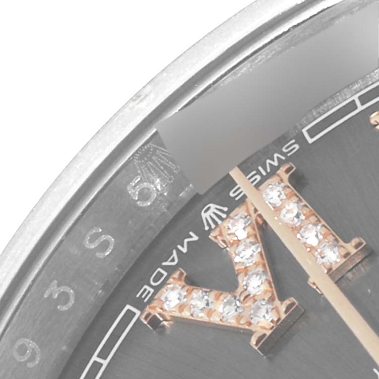 The image shows a close-up of the dial and bezel of a Rolex Datejust 126201 Men's Steel and Gold (two tone) Grey Dial 126201 Men's Steel and Gold (two tone) Grey Dial watch, featuring a diamond-set Roman numeral.