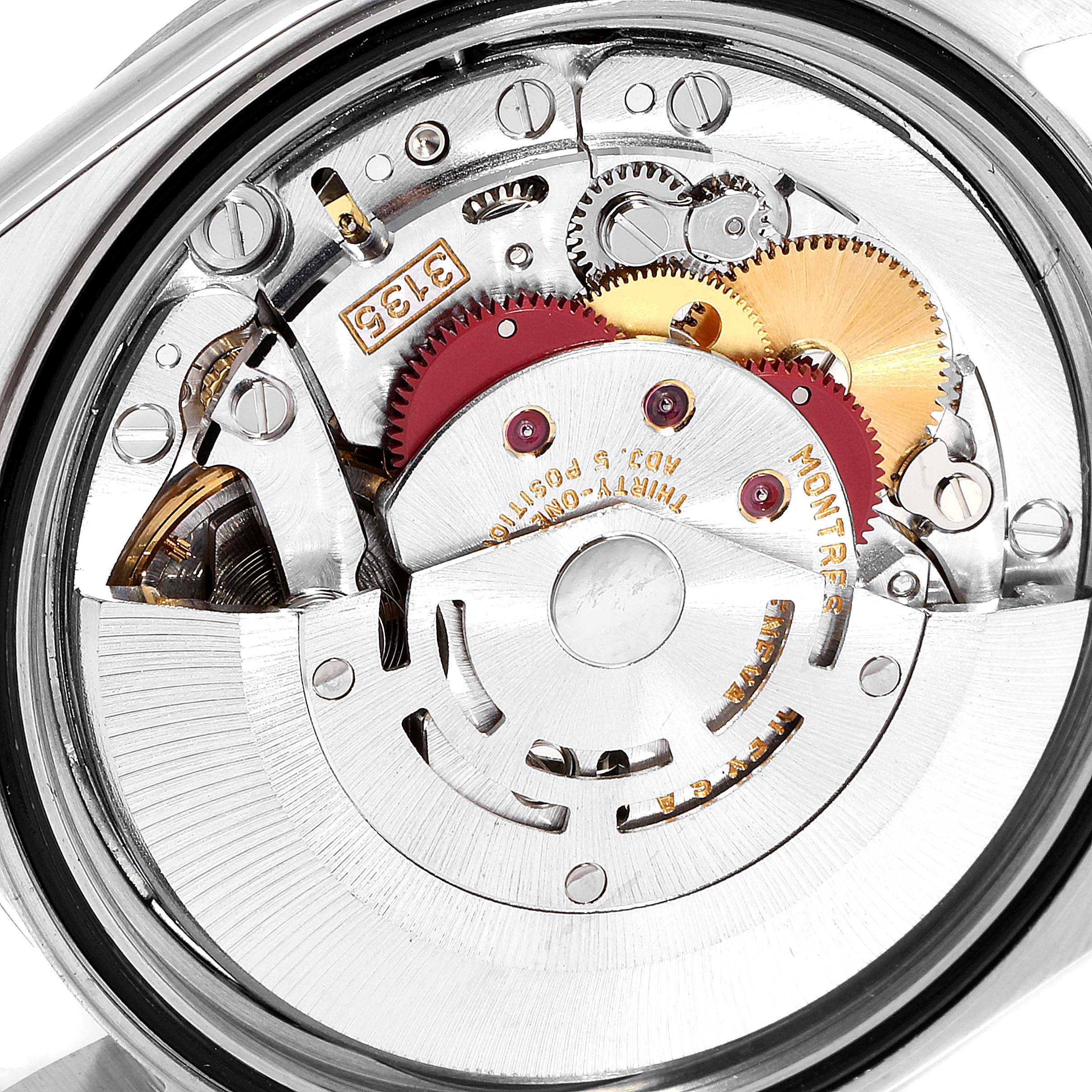 The image shows the internal mechanism of a Rolex Datejust 16234 Men's Stainless Steel White Dial 16234 Men's Stainless Steel White Dial watch, highlighting its gears and components.