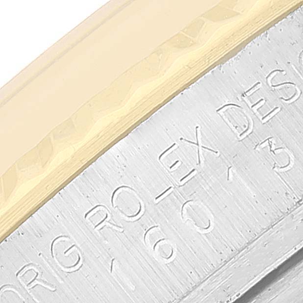 This close-up angle shows the edge of the bezel and the engraved case details of the Rolex Vintage Collection 16013 Men's Steel and Gold (two tone) Blue Dial 16013 Men's Steel and Gold (two tone) Blue Dial model.