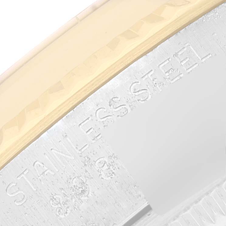 This close-up image of a Rolex Vintage Collection 16013 Men's Steel and Gold (two tone) Blue Dial 16013 Men's Steel and Gold (two tone) Blue Dial watch shows part of the bezel and the engraved "STAINLESS STEEL" text on the side.