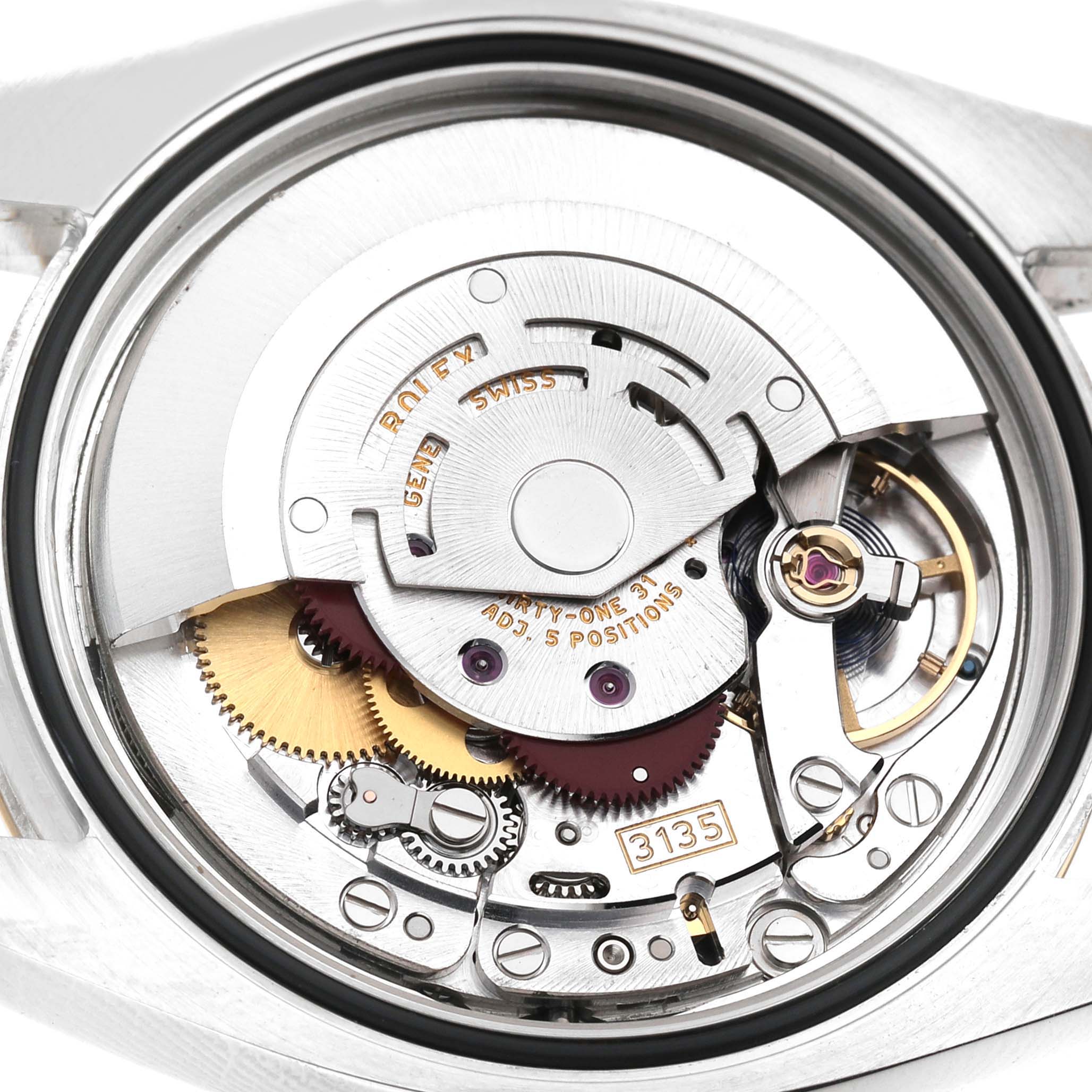 The image shows a close-up of the Rolex Datejust 116203 Men's Steel and Gold (two tone) Champagne Dial watch's movement, highlighting the intricate gears and rotor components.