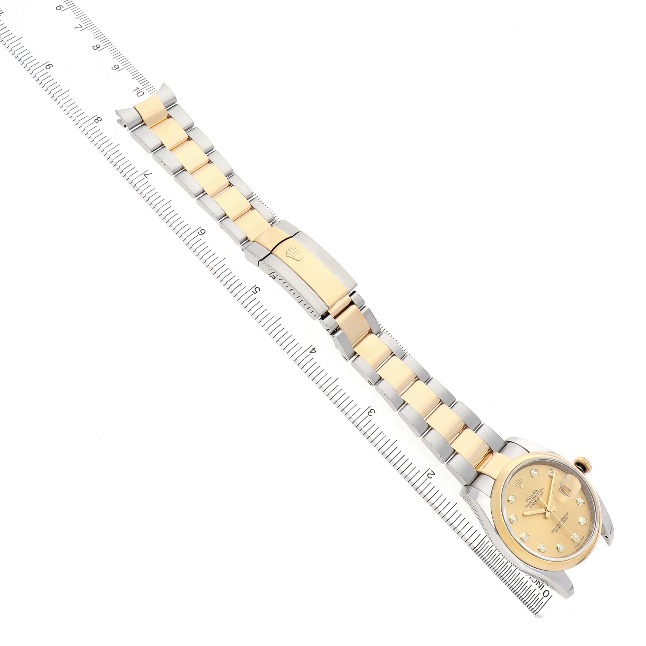 The image shows a Rolex Datejust 116203 Men's Steel and Gold (two tone) Champagne Dial watch at an angled top view, highlighting the bracelet, clasp, and dial.