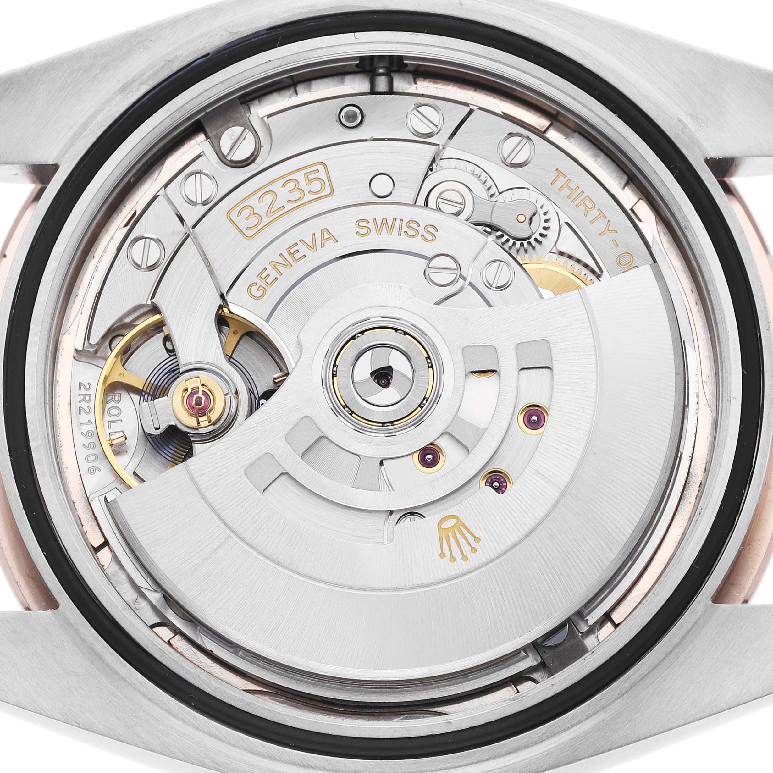 The image shows the open case back of a Rolex Datejust 41 126301 Men
s Steel and Gold (two tone) Pink Dial, highlighting its intricate movement components.