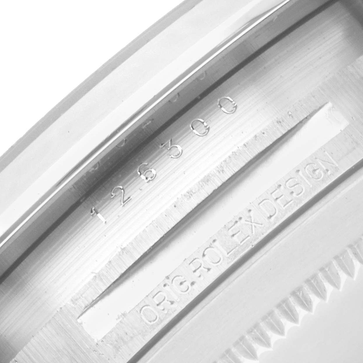 The image shows a close-up of the inner bezel of a Rolex Datejust 126300 Men
s Stainless Steel Grey Dial, displaying its reference numbers and "ORIG ROLEX DESIGN."