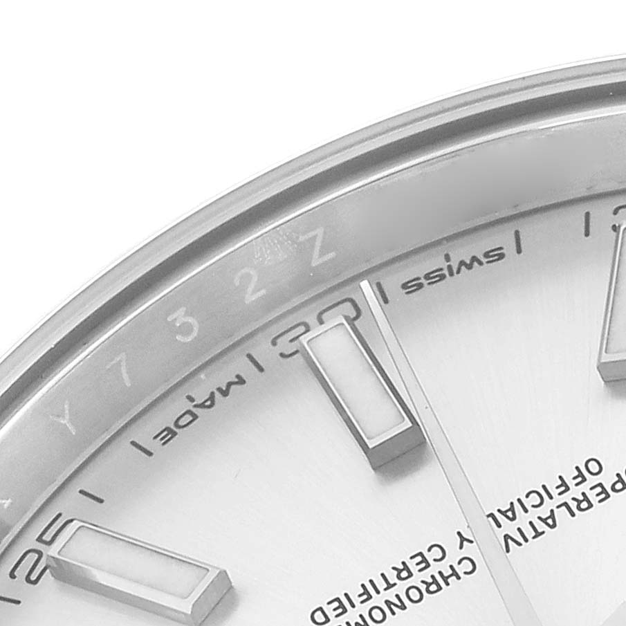 The image shows a close-up of the dial edge of a Rolex Datejust 41 126300 Men
s Stainless Steel Silver Dial, highlighting hour markers and part of the bezel.