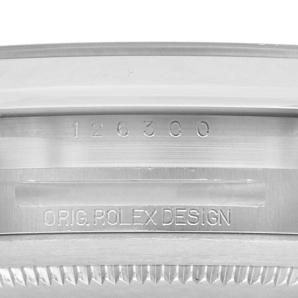 The image shows a close-up of the engraved bezel edge of a Rolex Datejust 41 126300 Men
s Stainless Steel Silver Dial, highlighting the model number and "Orig. Rolex Design."