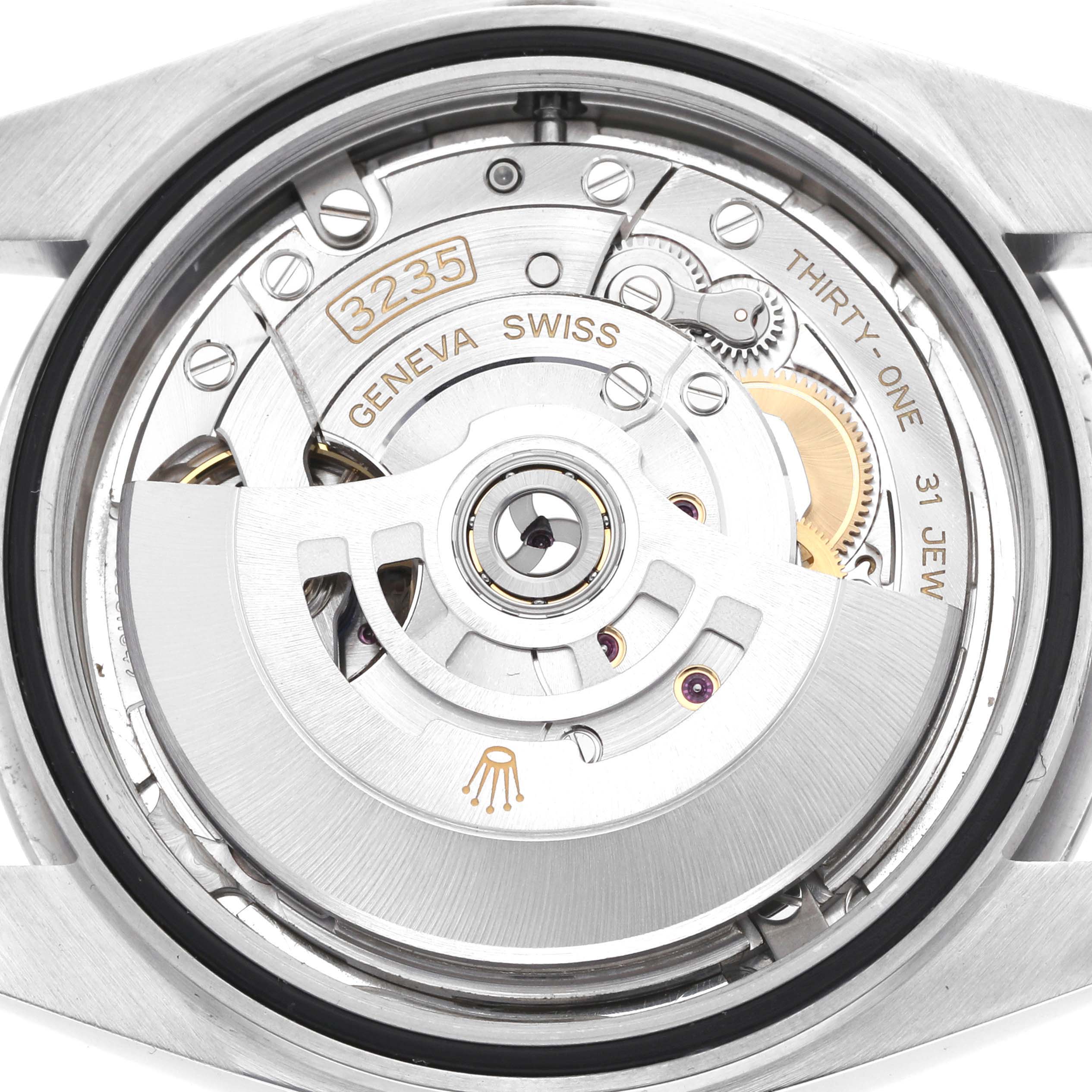 The image shows the movement of a Rolex Datejust 41 126300 Men
s Stainless Steel Silver Dial, viewed from the back, displaying intricate mechanical parts.