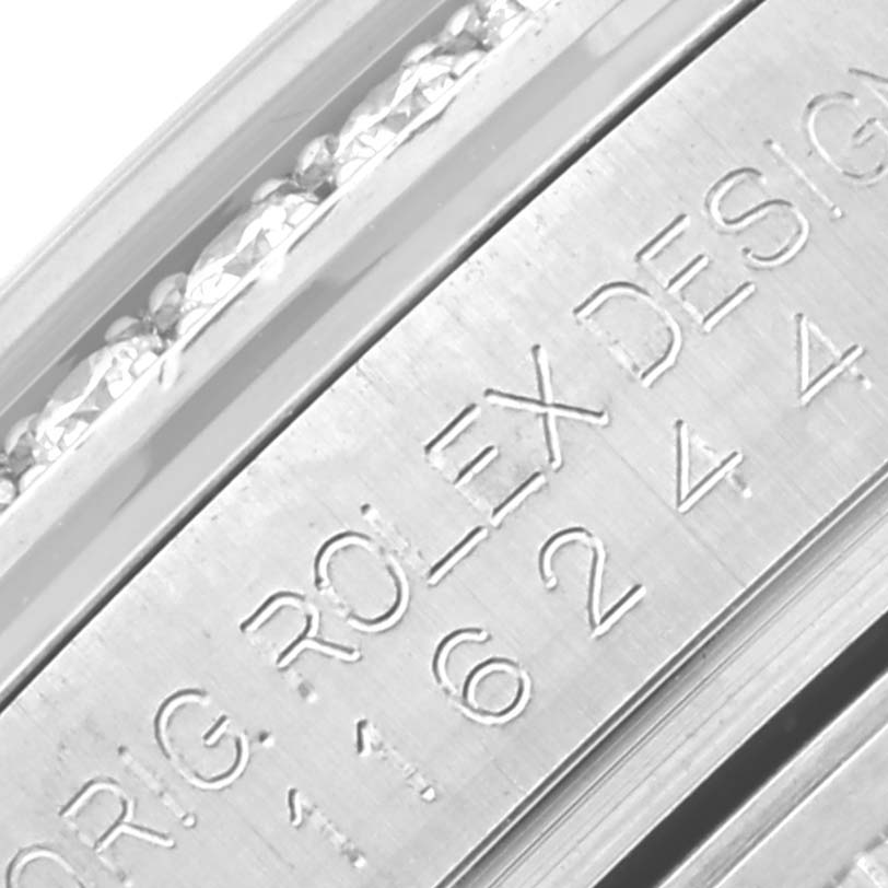 The image shows a close-up of the engraving on the case of a Rolex Datejust 116244 Men's Stainless Steel Black Dial 116244 Men's Stainless Steel Black Dial watch.