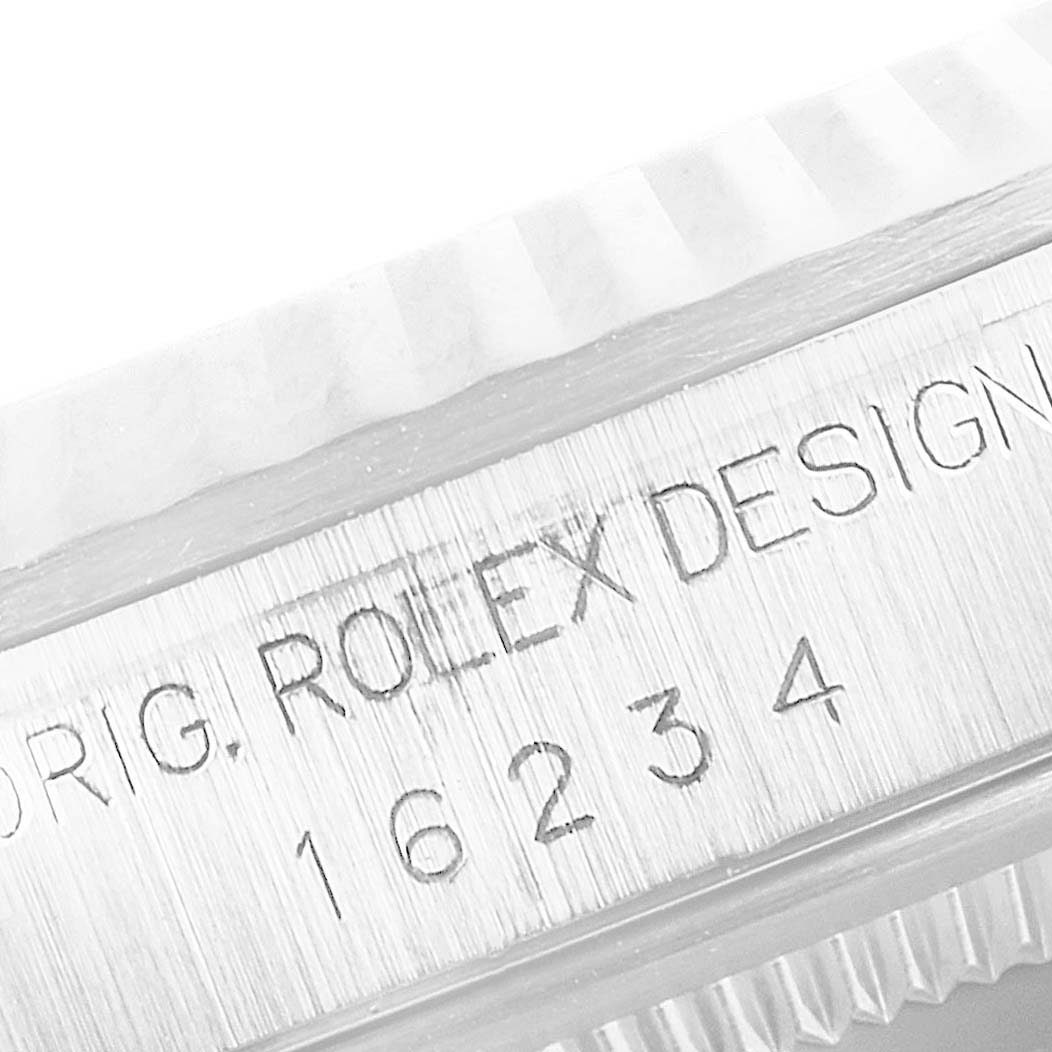 This image shows a close-up of the model number and "ROLEX" inscription on the side of the case of a Rolex Datejust 16234 Men's Stainless Steel Silver Dial 16234 Men's Stainless Steel Silver Dial watch.