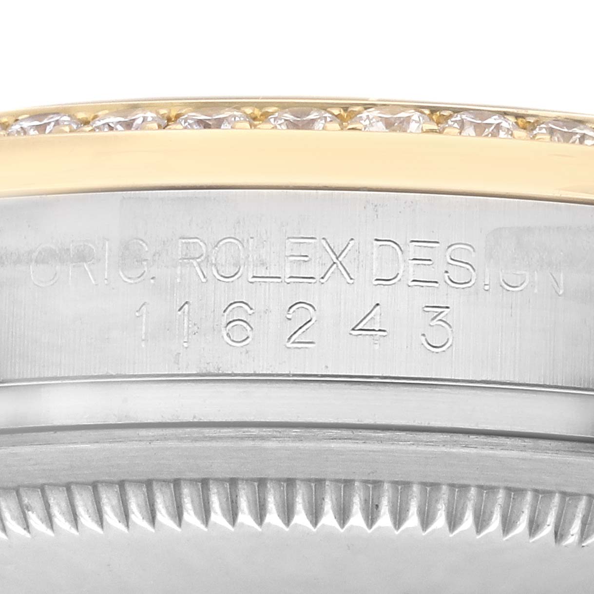 The image shows the side view of a Rolex Datejust 116243 Men's Steel and Gold (two tone) Champagne Dial, featuring the engraved serial number and diamond-accented bezel.