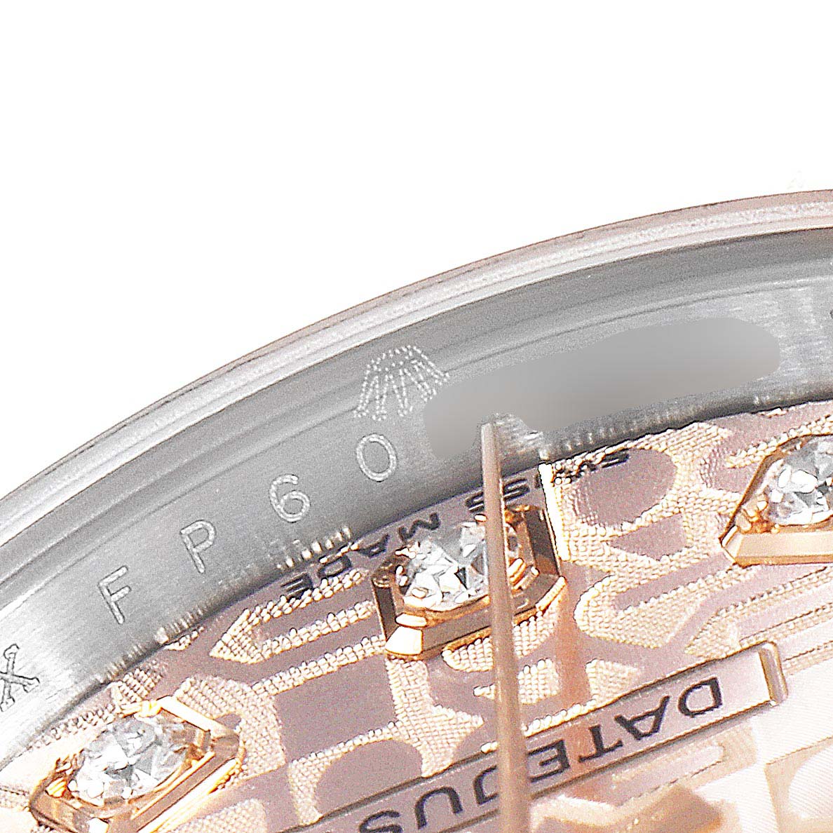 This close-up image of a Rolex Datejust 179171 Women's Rose Gold Pink Dial 179171 Women's Rose Gold Pink Dial watch shows the dial, diamonds, and part of the rehaut with the brand logo.