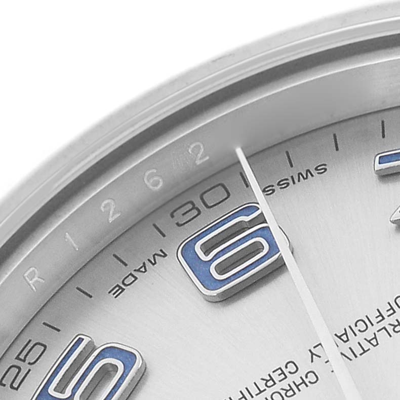 The image shows a close-up of the dial and edge of the bezel of a Rolex Datejust 41 116334 Men
s Stainless Steel Silver Dial, highlighting the numerals and text.