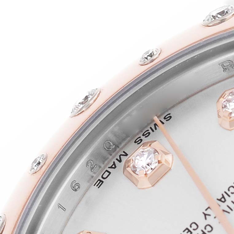 The image shows a close-up of the Rolex Datejust 178341 Women's Steel and Gold (two tone) Silver Dial watch's bezel and dial with diamond hour markers at an angled view.