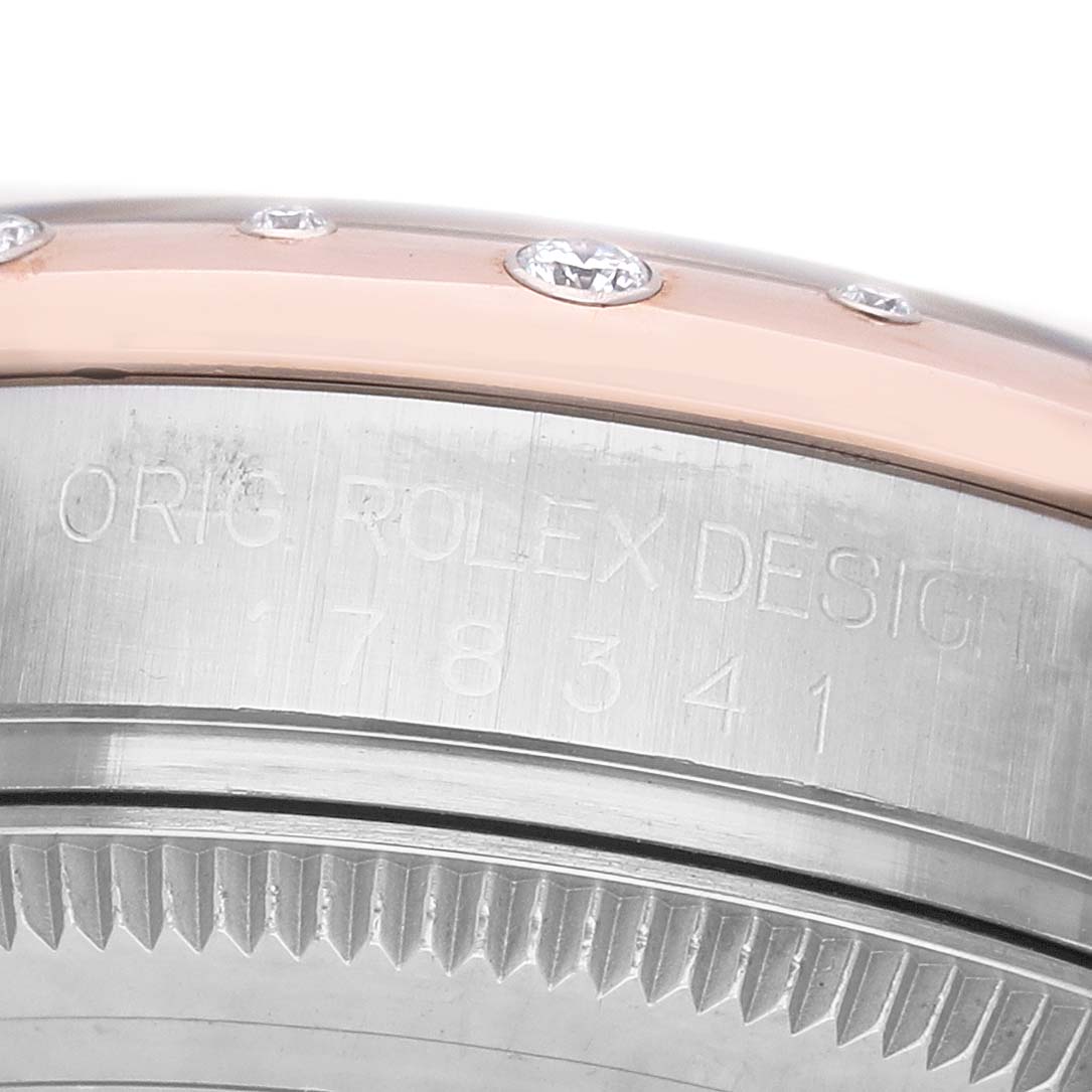 The image shows a close-up of the side of a Rolex Datejust 178341 Women's Steel and Gold (two tone) Silver Dial bezel and case with engraved model details.