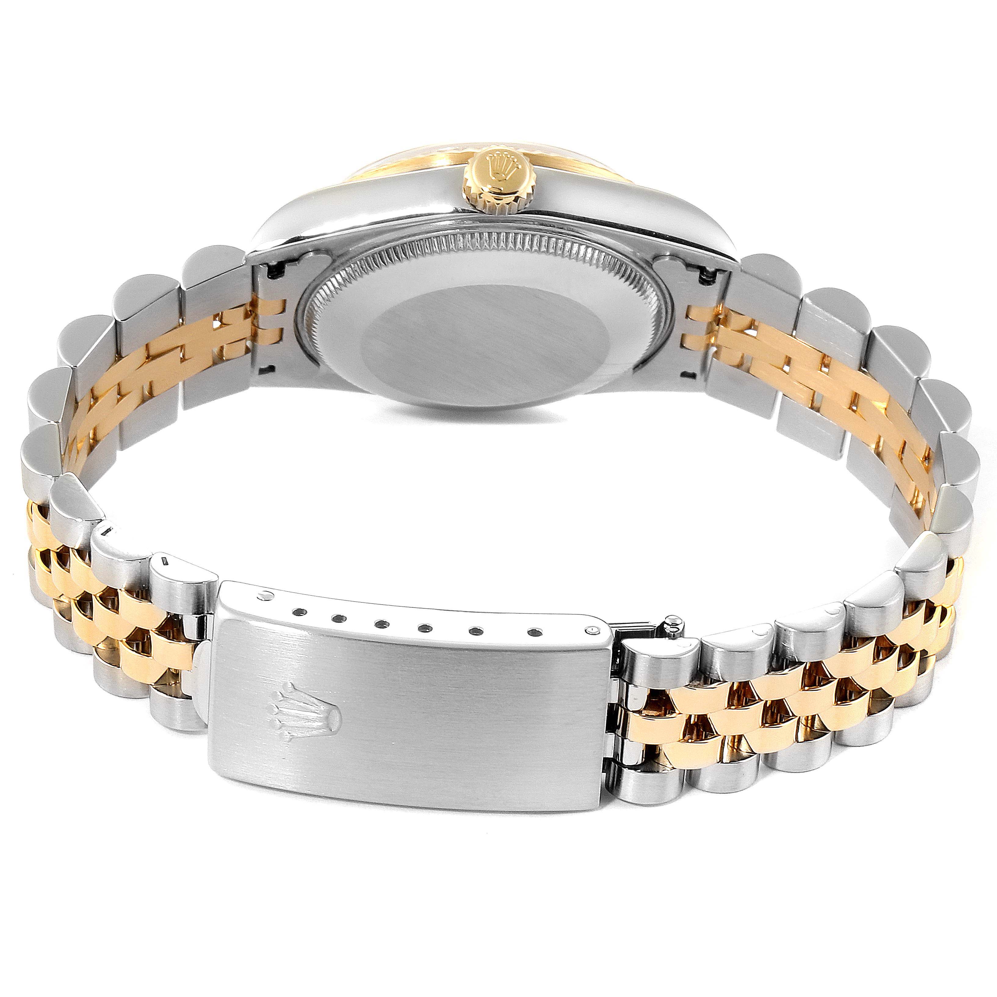 The image shows a rear view of a Rolex Mid-Size 68273 Women
s Steel and Gold (two tone) Champagne Dial 68273 Women
s Steel and Gold (two tone) Champagne Dial watch, highlighting its two-tone bracelet and clasp.