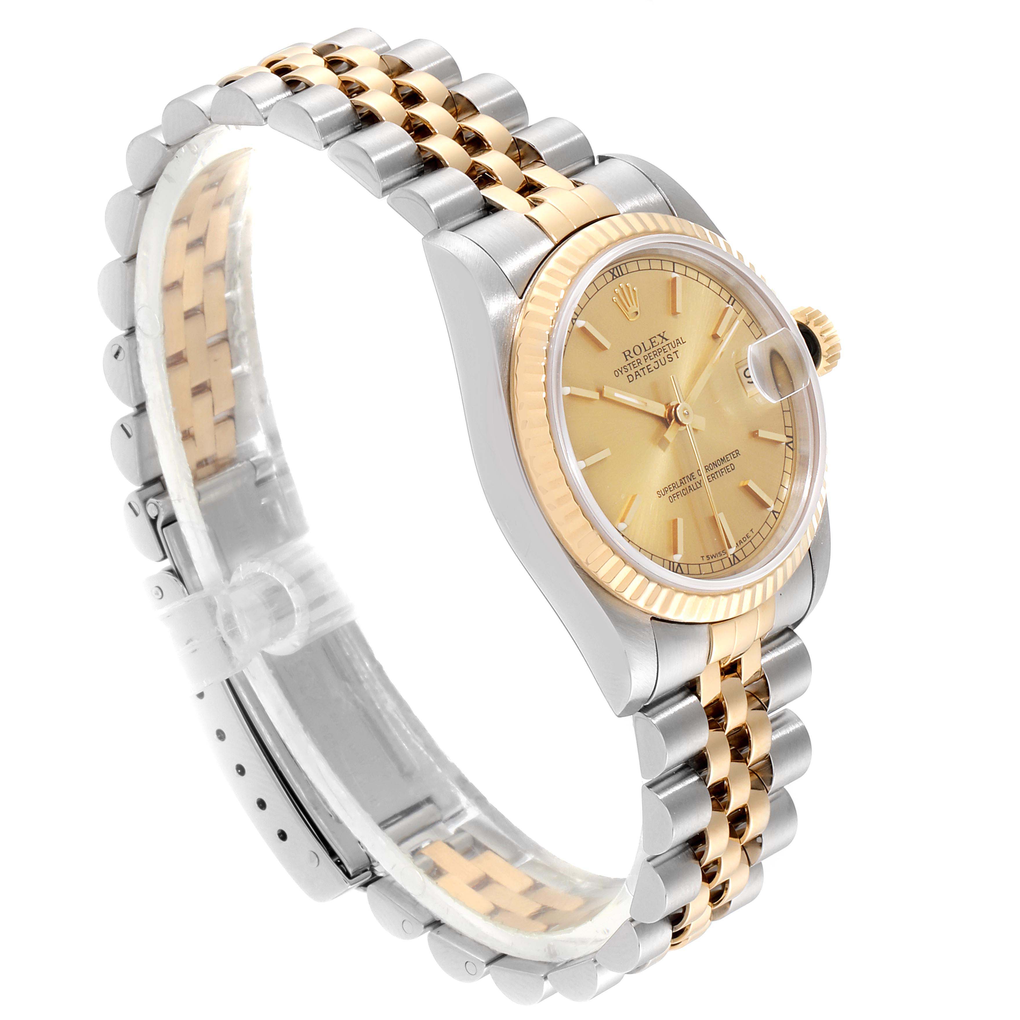 The image displays a Rolex Mid-Size 68273 Women
s Steel and Gold (two tone) Champagne Dial 68273 Women
s Steel and Gold (two tone) Champagne Dial model watch from a side angle, showing the face, bezel, and bracelet with a two-tone design.