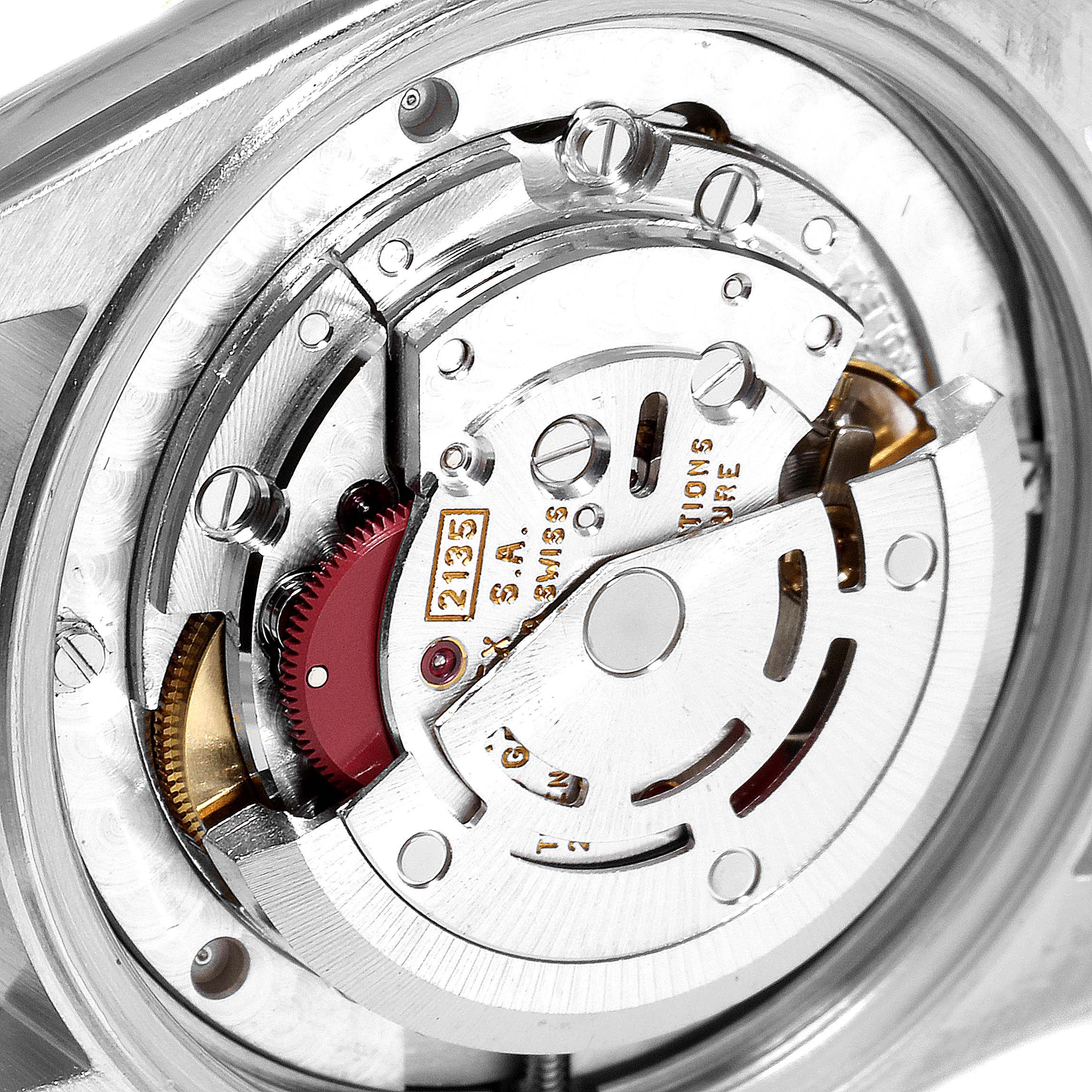 The image shows the movement and internal mechanism of a mid-size Rolex watch, viewed from the back.