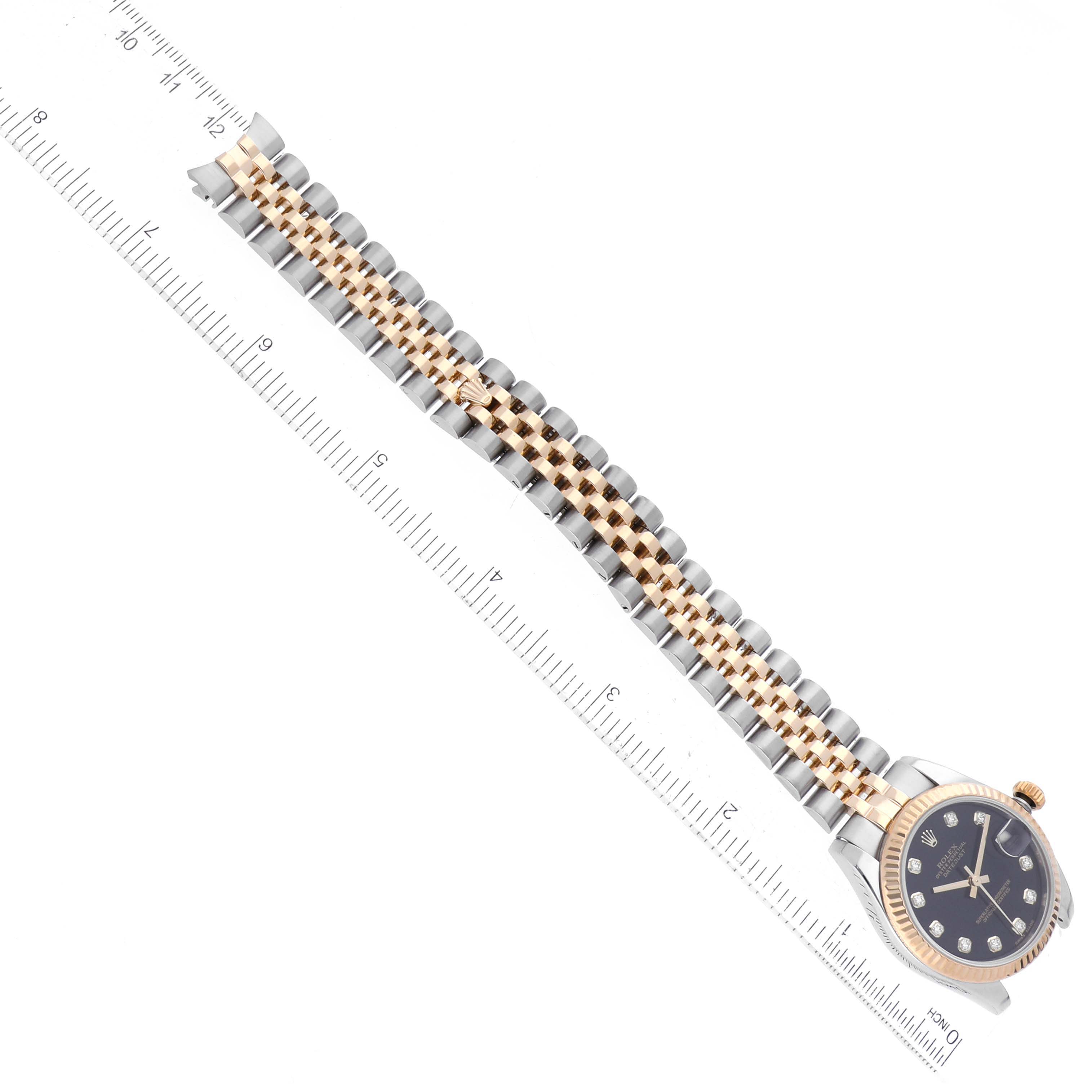 The image shows a Rolex Mid-Size 178273 Women's Steel and Gold (two tone) Black Dial 178273 Women's Steel and Gold (two tone) Black Dial watch at an angled top view, highlighting the two-tone bracelet and black face with gold accents.