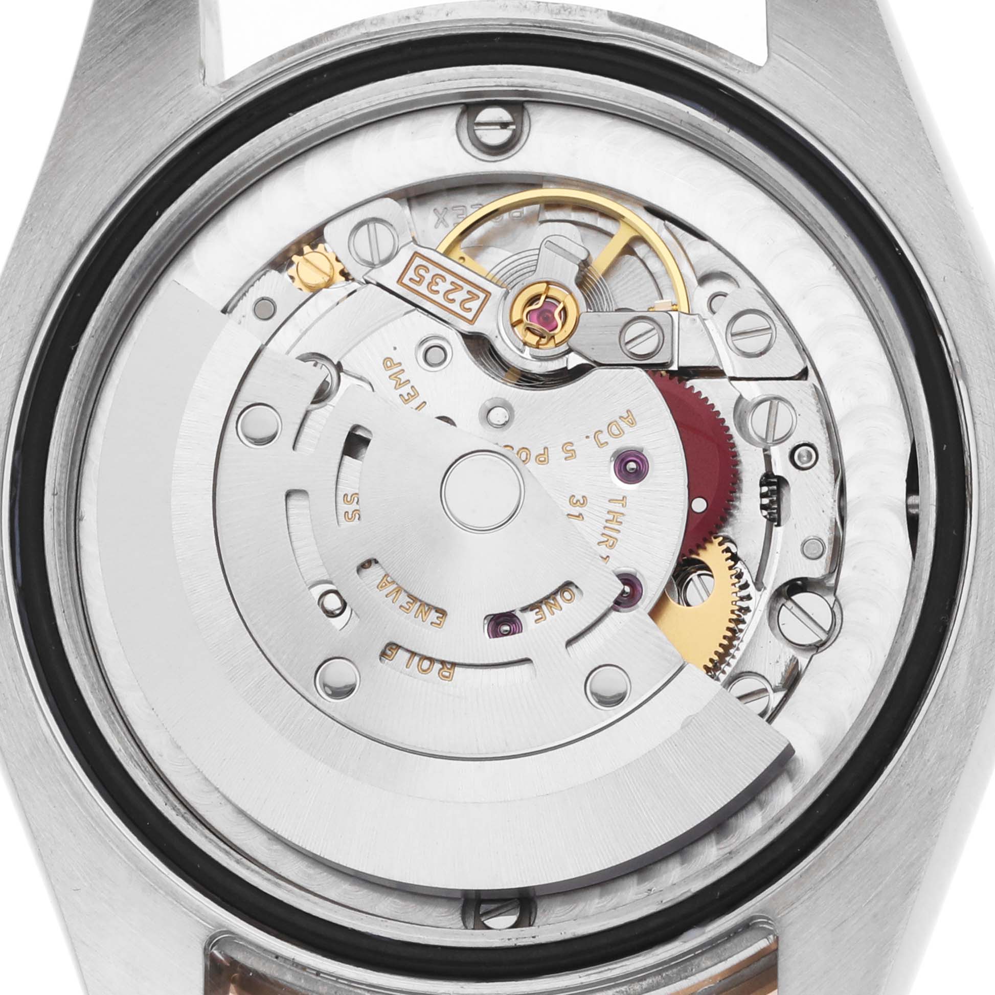 The image shows the movement mechanism of a Rolex Datejust 178341 Women's Steel and Gold (two tone) White Dial watch from a back angle, highlighting the rotor and gears.