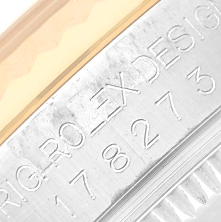 This close-up image shows the model and brand engravings on the side of a Rolex Mid-Size 178273 Women's Steel and Gold (two tone) Champagne Dial 178273 Women's Steel and Gold (two tone) Champagne Dial watch.