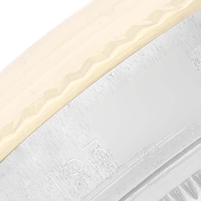 This image shows a close-up of the engraved edge and bezel of the Rolex Vintage Collection 1601 Men's Steel and Gold (two tone) Silver Dial 1601 Men's Steel and Gold (two tone) Silver Dial watch.