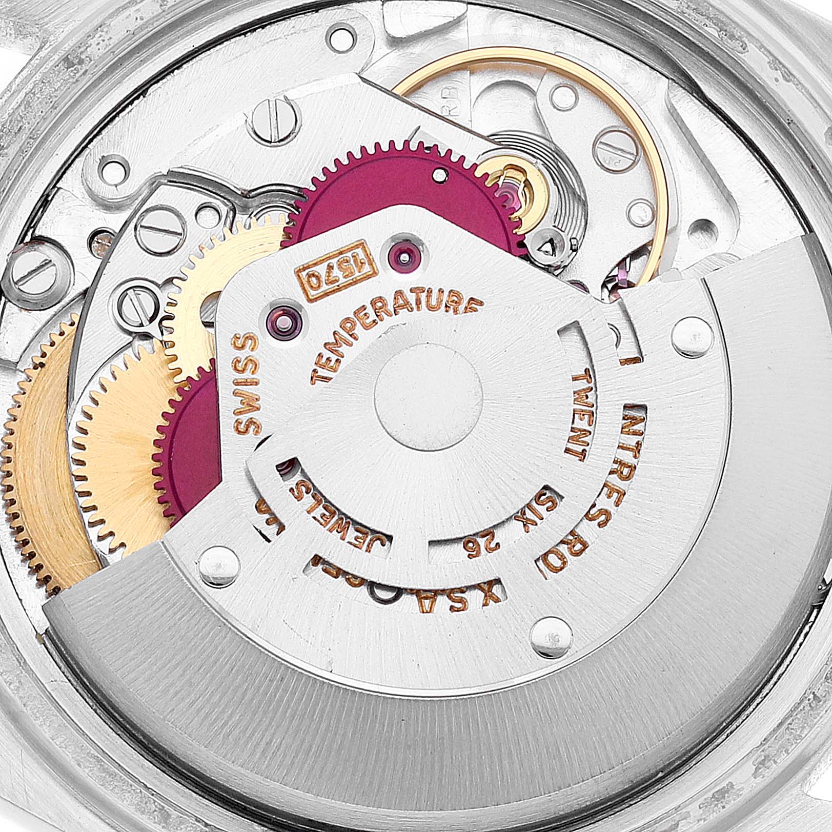 This image shows the intricate inner mechanisms and gears of the Rolex Vintage Collection 1601 Men's Steel and Gold (two tone) Silver Dial 1601 Men's Steel and Gold (two tone) Silver Dial watch from a close-up angle.