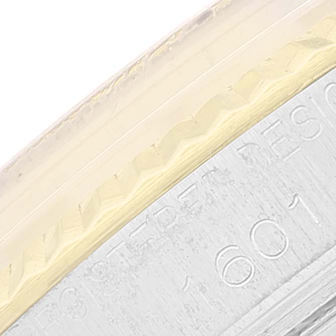 The image shows a close-up of the casing edge and part of the bezel of the Vintage Collection Rolex watch.