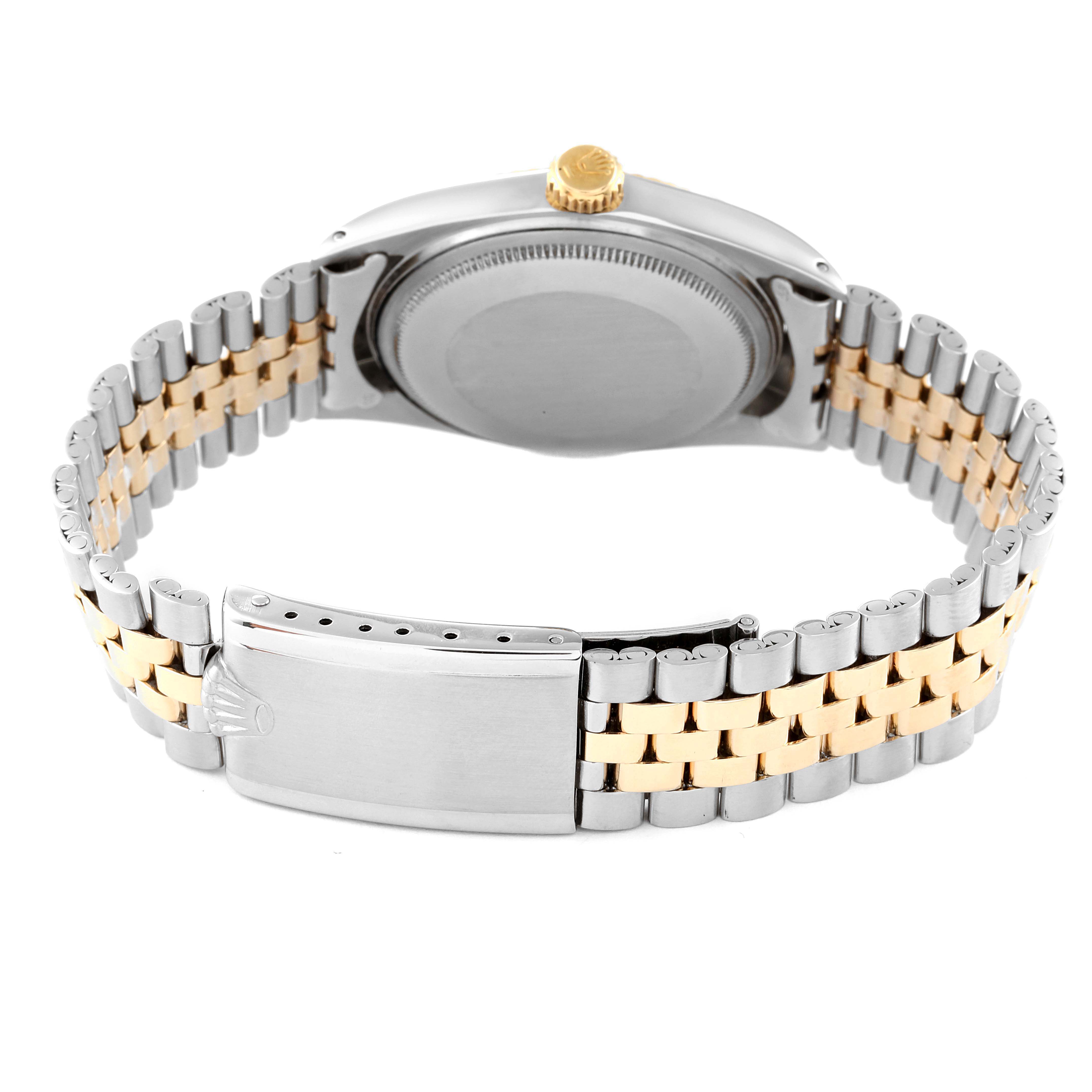 The image shows the back view of a Vintage Collection Rolex watch, highlighting the clasp, bracelet, and case back.