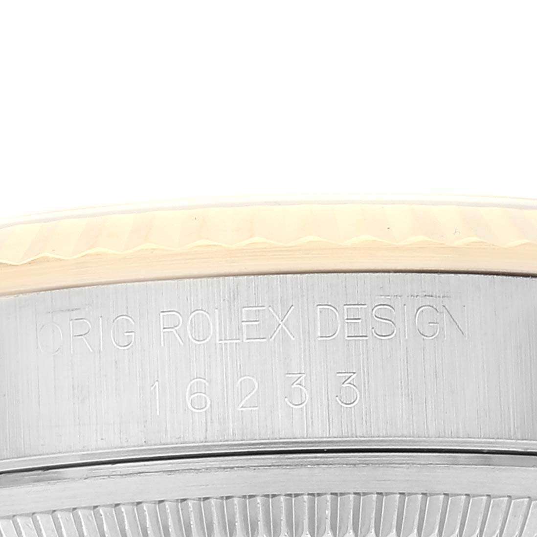 The image shows an up-close view of the side of a Rolex Datejust 16233 Men's Steel and Gold (two tone) White Dial 16233 Men's Steel and Gold (two tone) White Dial model, focusing on the engraved design and model number.
