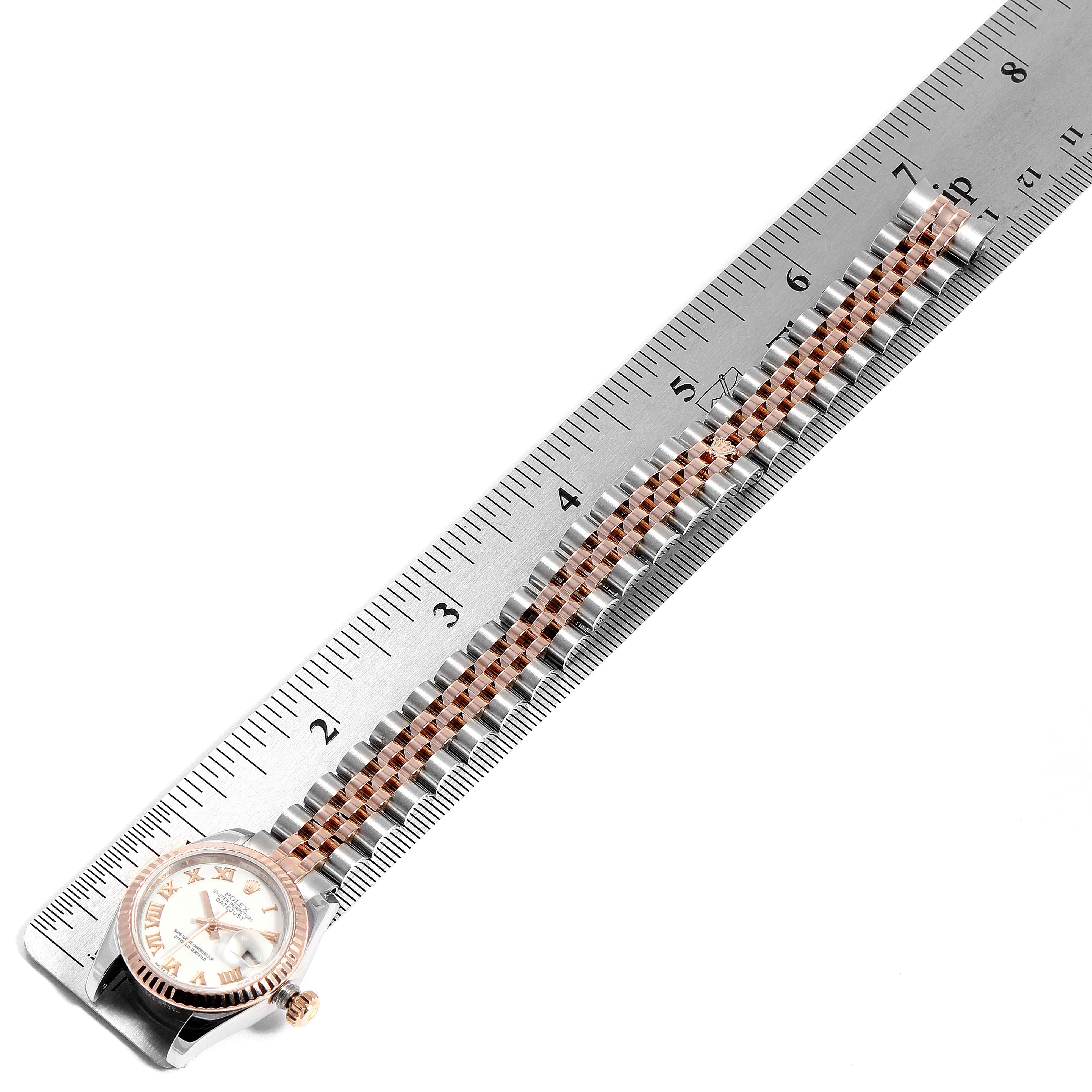 This image shows a top-down view of a Rolex Datejust 179171 Women's Steel and Gold (two tone) White Dial 179171 Women's Steel and Gold (two tone) White Dial watch with its bracelet measured against a ruler.