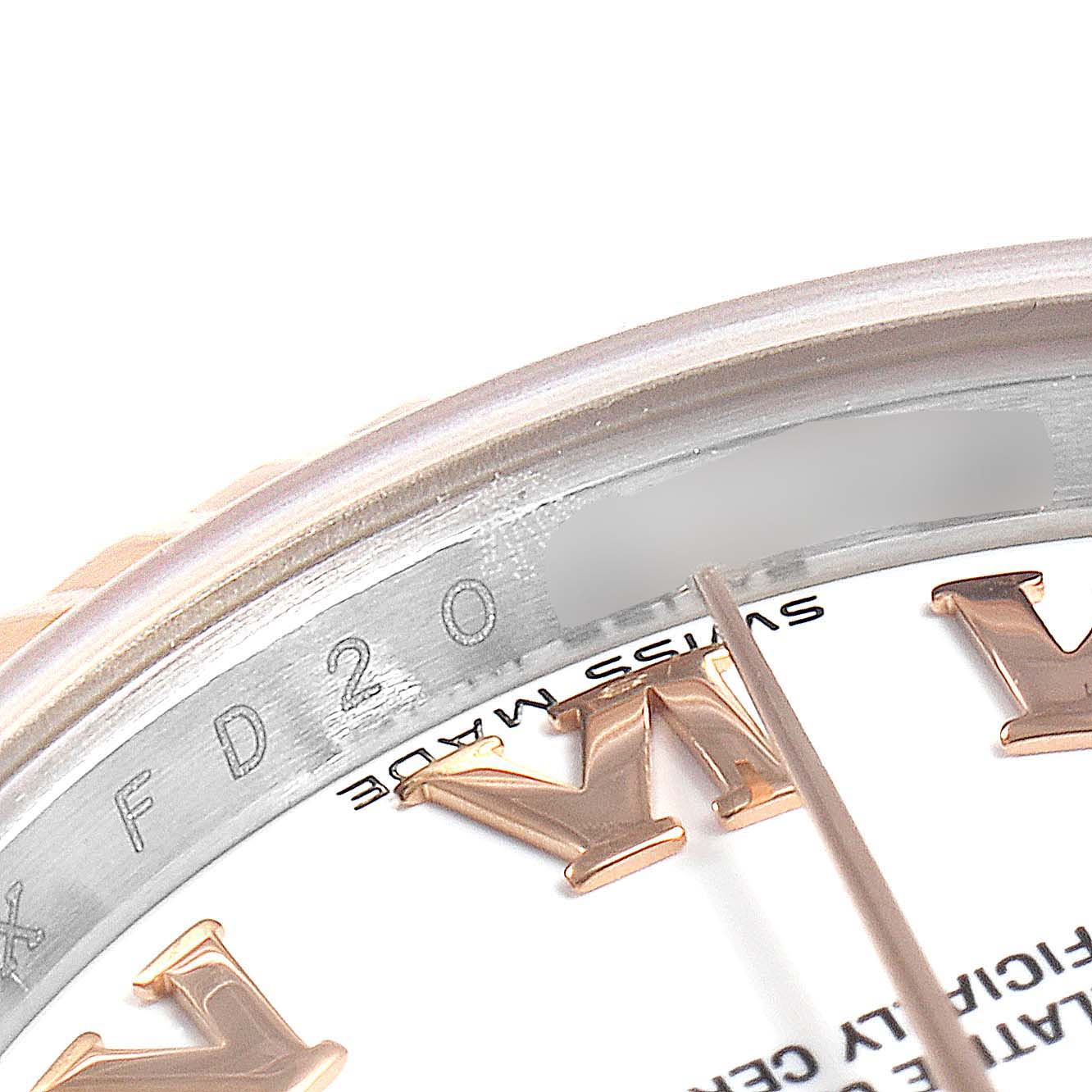 This image shows a close-up of the dial and inner bezel of a Rolex Datejust 179171 Women's Steel and Gold (two tone) White Dial 179171 Women's Steel and Gold (two tone) White Dial watch, highlighting part of the branding and the hour markers.