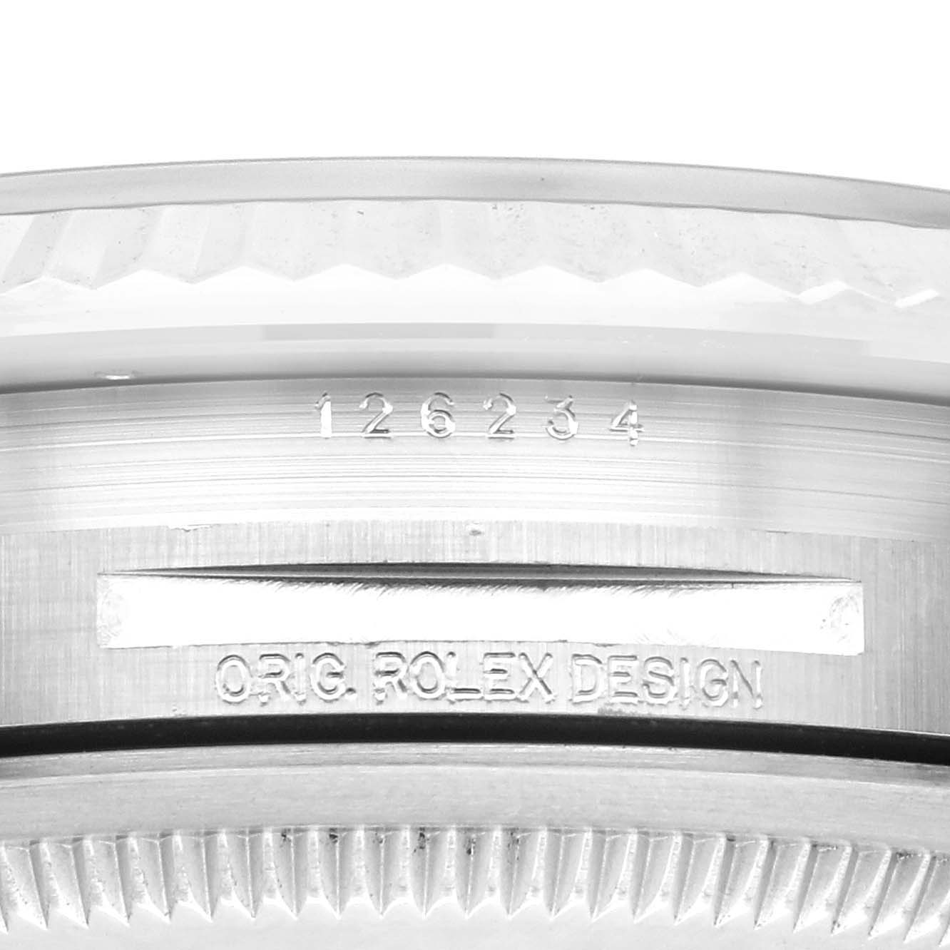 The image shows a close-up of the side of the bezel and the serial number of a Rolex Datejust 126234 Men's Stainless Steel Green Dial 126234 Men's Stainless Steel Green Dial model.