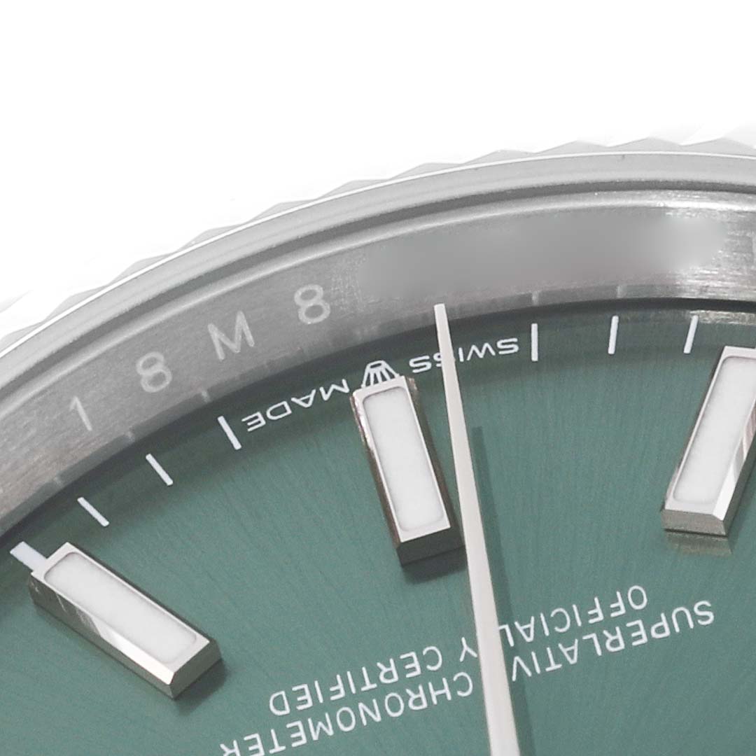 This image shows a close-up of the dial and hour markers of a Rolex Datejust 126234 Men's Stainless Steel Green Dial 126234 Men's Stainless Steel Green Dial watch.