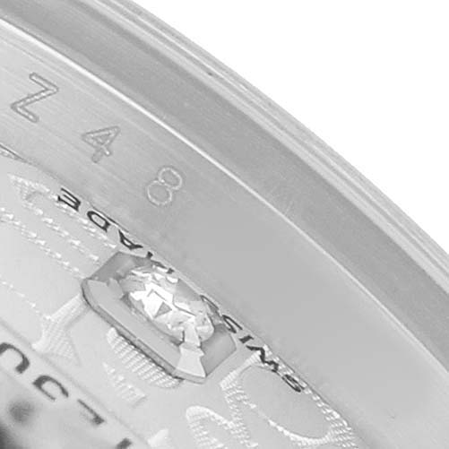 The image shows a close-up of the edge of the dial and rehaut of a Rolex Datejust 179174 Women's Stainless Steel Silver Dial watch, focusing on engravings and part of the logo.