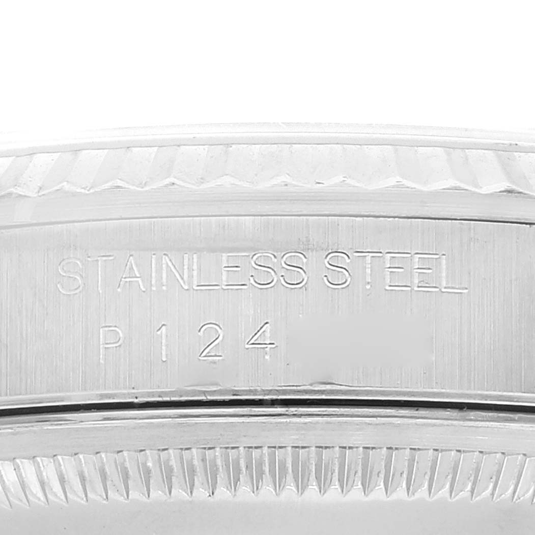 The image shows a close-up of the engravings on the stainless steel case of a Rolex Datejust 16234 Men's Stainless Steel Silver Dial 16234 Men's Stainless Steel Silver Dial watch.