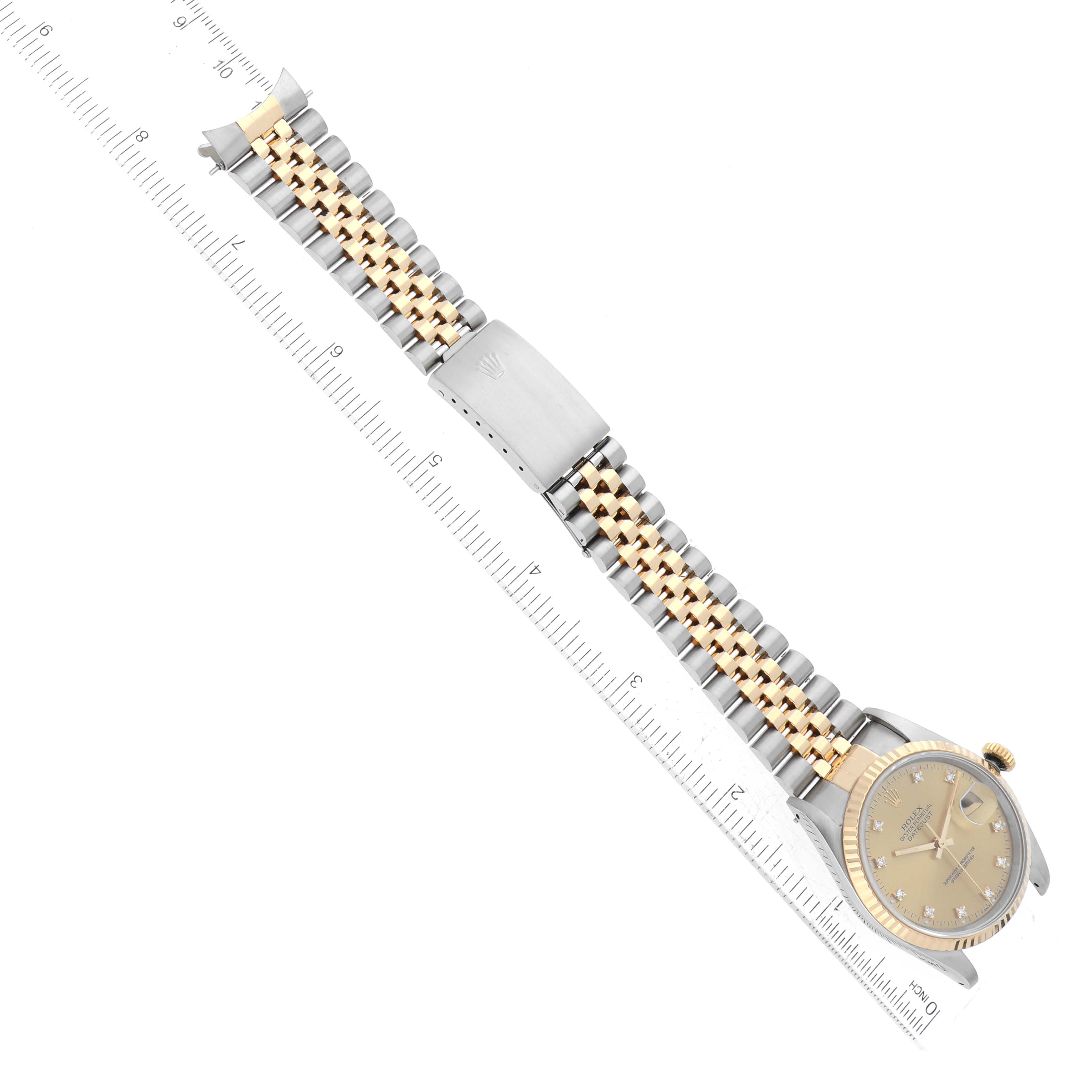 The Rolex Datejust 16233 Men's Steel and Gold (two tone) Champagne Dial 16233 Men's Steel and Gold (two tone) Champagne Dial watch is shown at a top-down angle, highlighting its bracelet, clasp, and face.