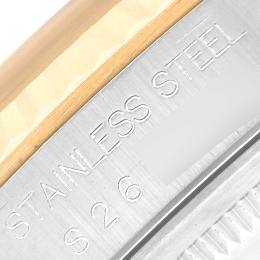 Close-up of the Rolex Datejust 16233 Men's Steel and Gold (two tone) Champagne Dial 16233 Men's Steel and Gold (two tone) Champagne Dial stainless steel case, showcasing the engraved "STAINLESS STEEL" text.